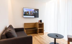 Televiisor ja/või meelelahutuskeskus majutusasutuses Hotel South Coast