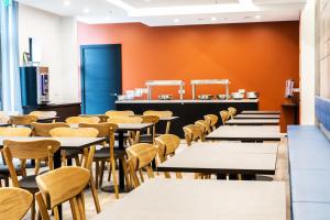 Restoran või mõni muu söögikoht majutusasutuses Hotel South Coast