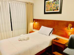 Ένα ή περισσότερα κρεβάτια σε δωμάτιο στο Hotel Daylu