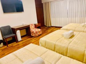 Ένα ή περισσότερα κρεβάτια σε δωμάτιο στο Hotel Daylu