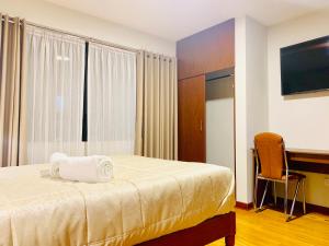 Ένα ή περισσότερα κρεβάτια σε δωμάτιο στο Hotel Daylu