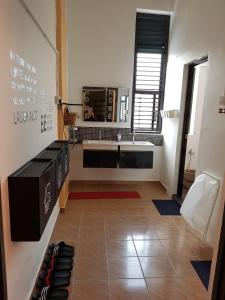 a room with a large room with a table and chairs at Home@KKB in Kuala Kubu Baharu