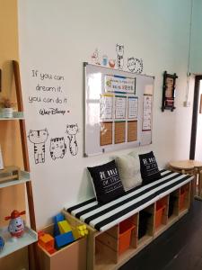 a playroom with a table and a shelf with toys at Home@KKB in Kuala Kubu Baharu