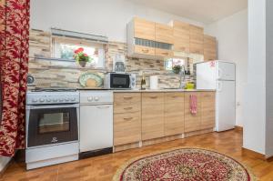 a kitchen with a stove and a refrigerator at Vacation House "Andy" in Pula