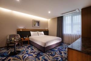 Postel nebo postele na pokoji v ubytování Shin Shin Hotel Jeju Airport + 37 fotografií