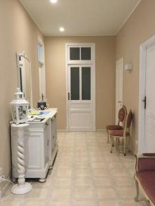 a bathroom with a white stove and a white door at B&b note di mare in Imperia