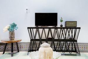 TV a/nebo společenská místnost v ubytování El Charco Suites