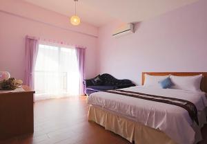 מיטה או מיטות בחדר ב-Summertimeph Homestay