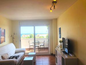 TV a/nebo společenská místnost v ubytování Casa con vistas al mar