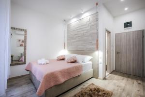 Postel nebo postele na pokoji v ubytování D&D Suites in Split Centre