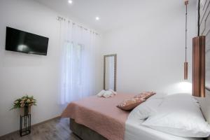 Postel nebo postele na pokoji v ubytování D&D Suites in Split Centre