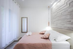 Postel nebo postele na pokoji v ubytování D&D Suites in Split Centre
