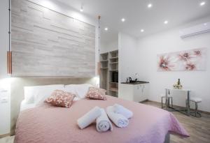 Postel nebo postele na pokoji v ubytování D&D Suites in Split Centre