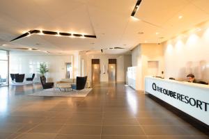 a lobby of a chiropractic office with a reception desk at The Qube Resort Jeju in Seogwipo