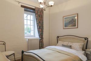 a bedroom with a bed and a window at Picturesque country house - Le Mini Vau in Continvoir +13 photos