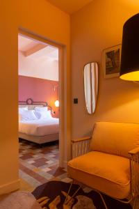 Postel nebo postele na pokoji v ubytování Le petit hotel