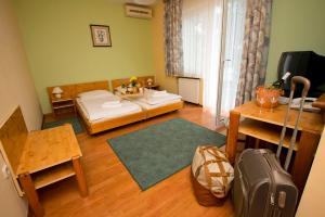 Postel nebo postele na pokoji v ubytování Motel Kod Bakija + 22 fotografií