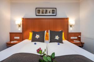 Postel nebo postele na pokoji v ubytování Hotel Das Schlossberg superior