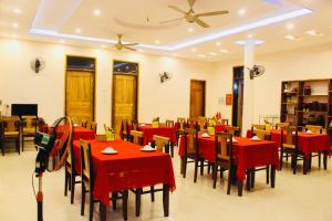 a dining room with red tables and chairs at Ba Be Legend Hotel in Ba Be18
