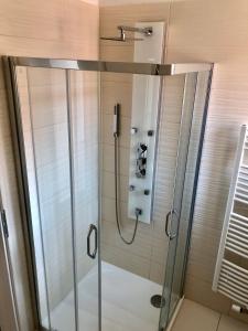 a shower with a glass door in a bathroom at Apartmán Pisek centrum in Písek