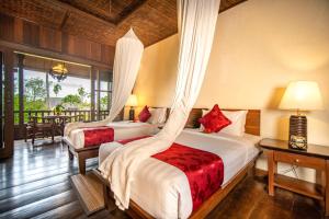 Tempat tidur dalam kamar di Ananda Ubud Resort