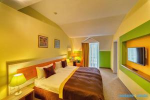 מיטה או מיטות בחדר ב-Shishkinn Resort&Spa