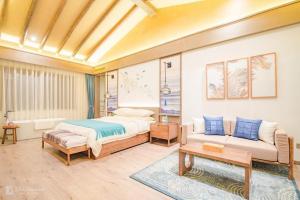 Postelja oz. postelje v sobi nastanitve Blossom Hill Yuejingzhuang Hotel