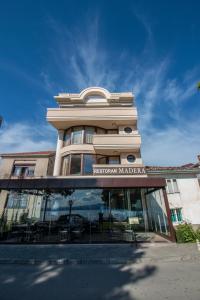 a building with a sign on the front of it at Villa Darko - VIP Accomodations in Ohrid