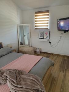 Ένα ή περισσότερα κρεβάτια σε δωμάτιο στο Apartment Magic