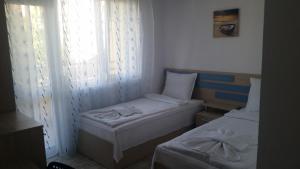 Postel nebo postele na pokoji v ubytování Blue House