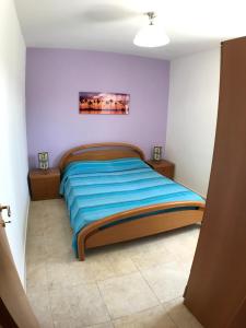 Tempat tidur dalam kamar di WHITE POOL Matino - Gallipoli - 7pl