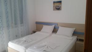 Postel nebo postele na pokoji v ubytování Blue House