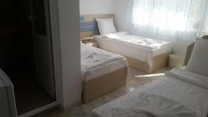 Postel nebo postele na pokoji v ubytování Blue House