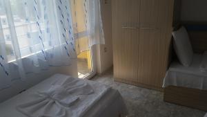 Postel nebo postele na pokoji v ubytování Blue House