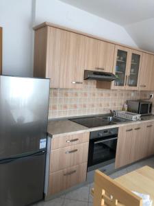 Kuchyň nebo kuchyňský kout v ubytování Apartment Laura + 22 fotografií