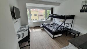 Posteľ alebo postele v izbe v ubytovaní Small Apartments Denisa Business