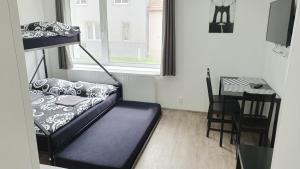 Posteľ alebo postele v izbe v ubytovaní Small Apartments Denisa Business
