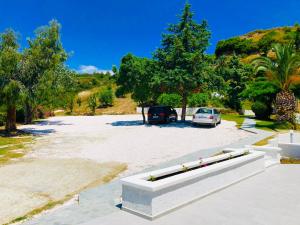 a parking lot with a car parked in it at Alexandrina in Mola Kalyva
