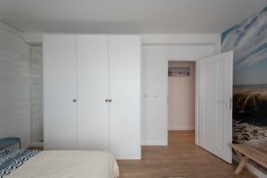 Postel nebo postele na pokoji v ubytování Apartament Zefir Mechelinki