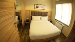 Postel nebo postele na pokoji v ubytování Mist Hotel & Spa