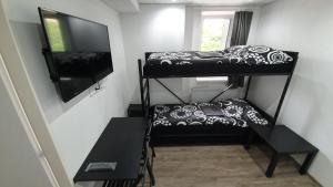 Posteľ alebo postele v izbe v ubytovaní Small Apartments Denisa Business