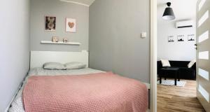 Posteľ alebo postele v izbe v ubytovaní Apartament Poznańska24