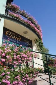 a building with flowers on the side of it at Hotel Court Wellness&Spa in Kędzierzyn-Koźle