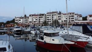 a group of boats docked in a marina with buildings at DOM LORON in Poreč