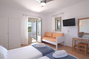 Posteľ alebo postele v izbe v ubytovaní Golden Sand Paros