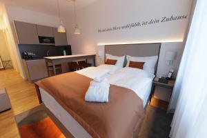 a hotel room with a large bed and a large window at HighPark by Palmira in Berlin