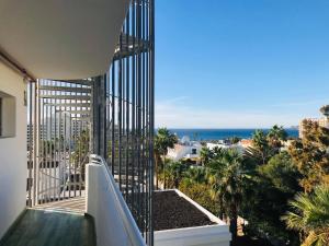 a balcony with a view of the ocean at Coral California - Adults Only in Playa de las Americas