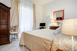 Llit o llits en una habitació de Hotel San Lino