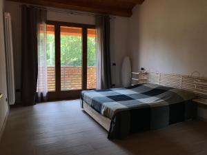 Posteľ alebo postele v izbe v ubytovaní Casa vacanze Agli ulivi