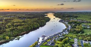 an aerial view of a river in a city at Ice House Hotel in Ballina